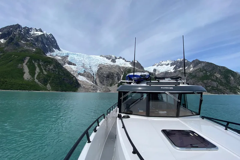 Slide: The Image of 2019 Sargo 36 Explorer yacht in a storage facility, showcasing deck and railing. - 7