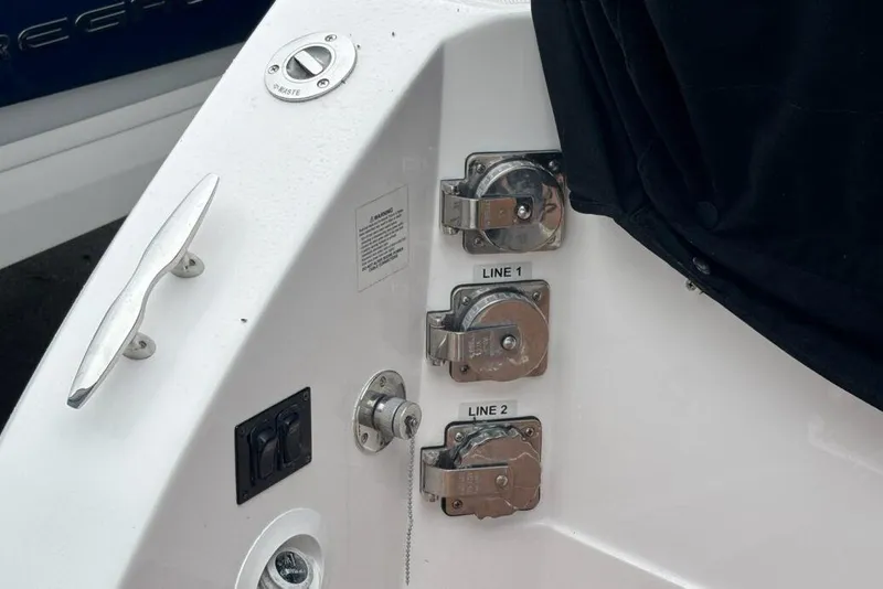 Slide: The Image of 2019 Regal 33 XO boat deck with cleat and line holders. - 21