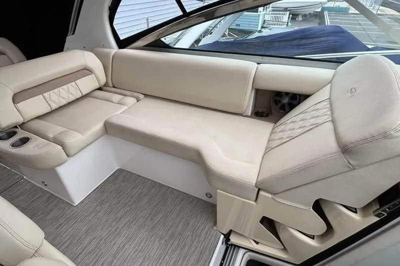 Slide: The Image of Luxurious interior seating of 2019 Regal 33 XO boat with beige upholstery. - 9