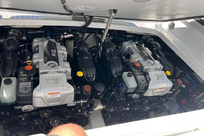 Slide: The Image of Engine compartment of a 2015 Formula 310 Sun Sport boat, featuring dual V8 engines. - 15