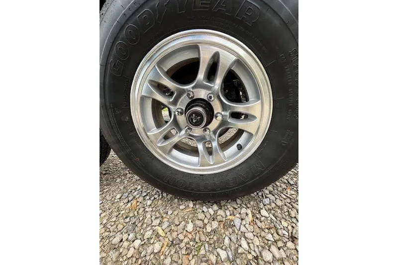 Slide: The Image of Close-up of a Goodyear tire on a Formula 310 Sun Sport, 2015 model. - 24