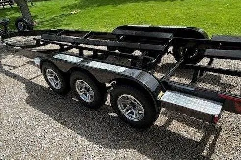 Slide: The Image of Triple-axle boat trailer for 2015 Formula 310 Sun Sport on gravel surface. - 25