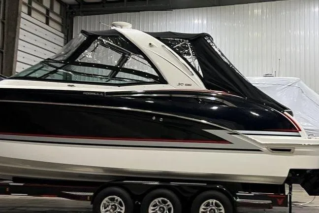 Slide: The Image of 2015 Formula 310 Sun Sport boat in indoor storage on a trailer. - 4