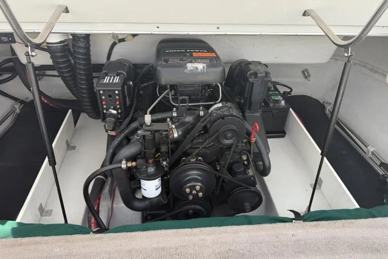 Slide: The Image of Engine compartment of a 1998 Cobalt 220 boat, showcasing detailed mechanical components. - 12