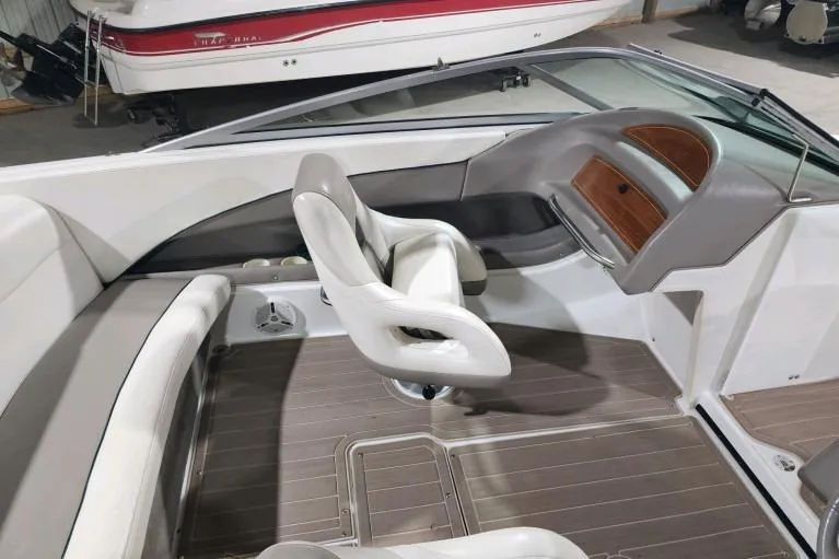 Slide: The Image of Interior of a 1998 Cobalt 220 boat with white seating and wood accents. - 8