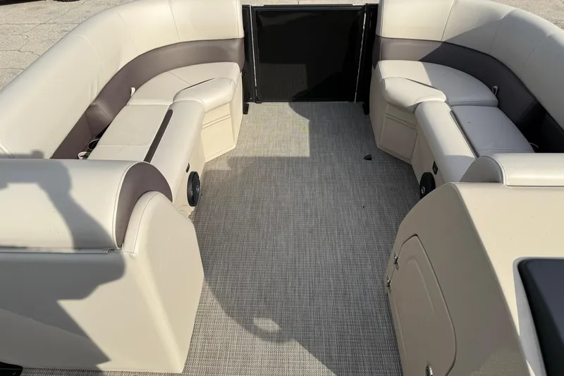 Slide: The Image of Interior of 2026 Bentley Pontoons Legacy 223 Navigator with beige seating and carpet. - 13