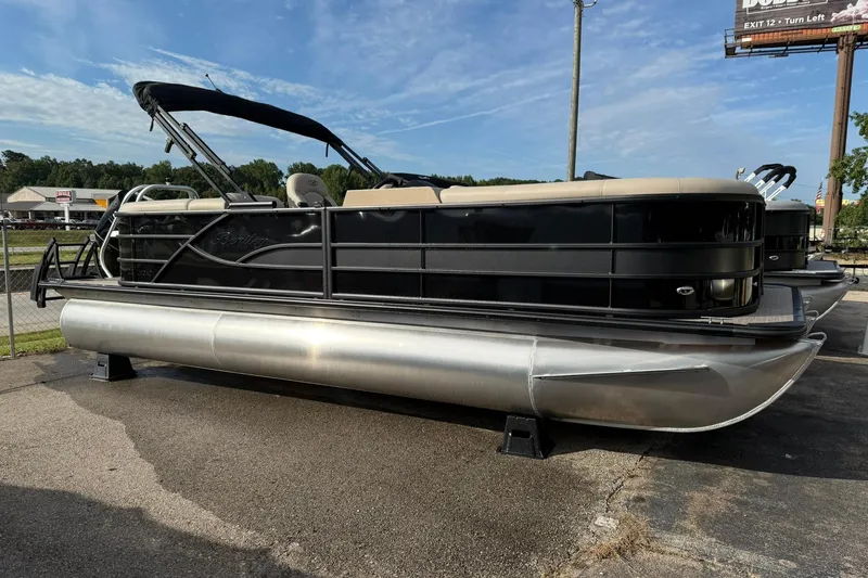 Slide: The Image of 2026 Bentley Pontoons Legacy 223 Navigator, black exterior, parked on pavement under a clear sky. - 3