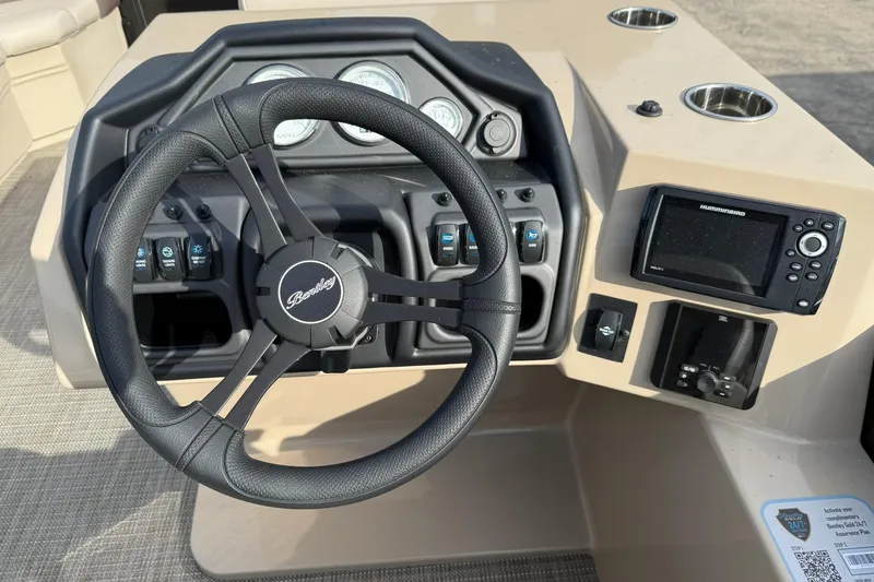 Slide: The Image of Steering console of 2026 Bentley Pontoons Legacy 223 Navigator with modern controls and gauges. - 8