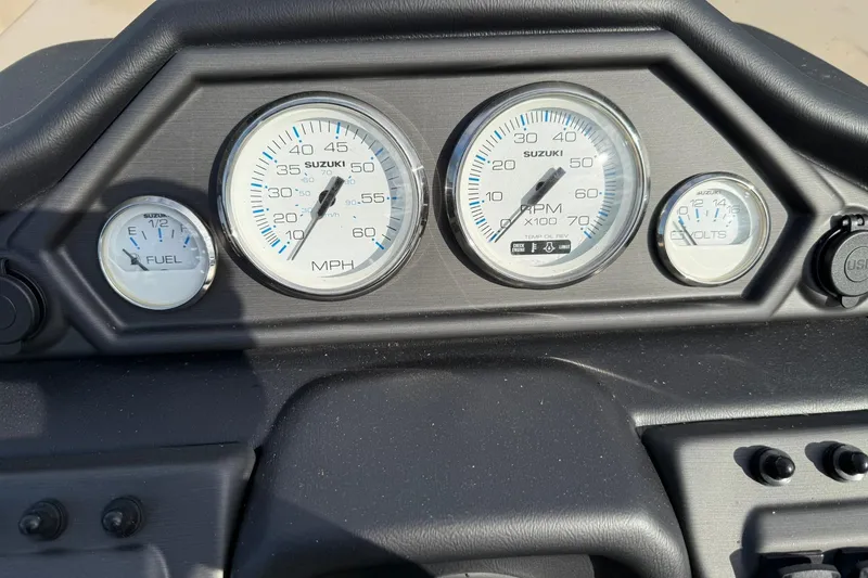 Slide: The Image of Dashboard of 2026 Bentley Pontoons Legacy 223 Navigator with gauges for speed, RPM, fuel, and volts. - 9