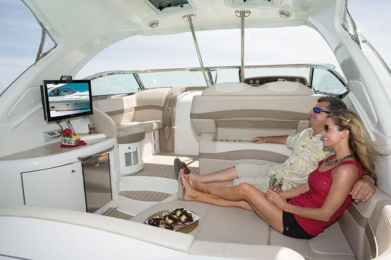 Slide: The Image of Couple relaxing on a 2014 Formula 37 Cruiser yacht interior. - 40