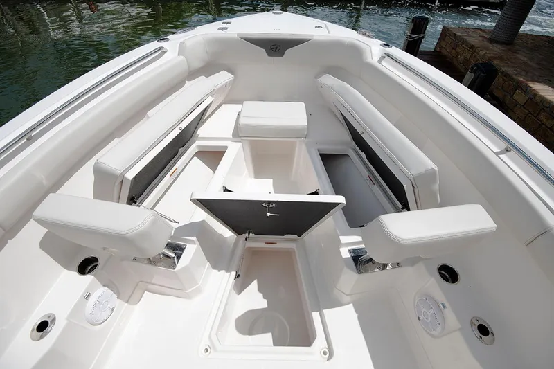 Slide: The Image of 2026 Sailfish 272 CC SE boat interior with white seating and storage compartments. - 14