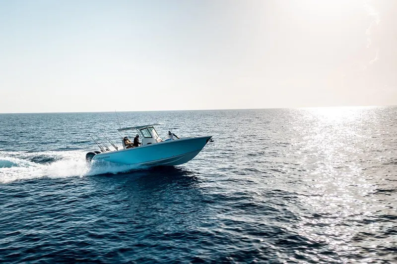 Slide: The Image of 2026 Sailfish 272 CC SE cruising on open ocean under bright sunlight. - 4