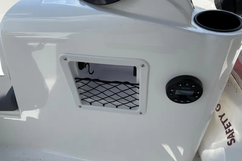 Slide: The Image of 2021 Bayliner Element E16 boat dashboard with storage net and control panel. - 10