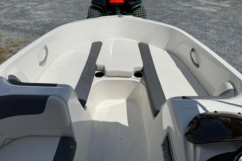 Slide: The Image of 2021 Bayliner Element E16 boat interior with seating and storage compartments. - 8