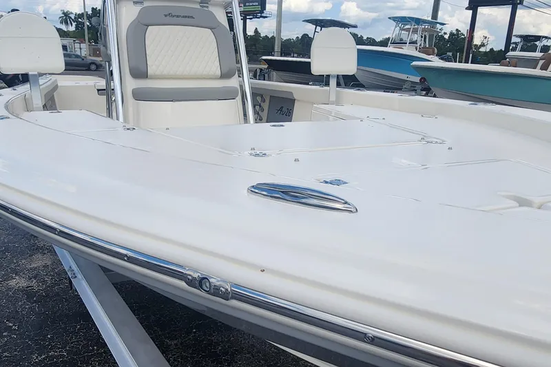 Slide: The Image of 2026 Avenger AV26 boat with sleek white deck and comfortable seating. - 14