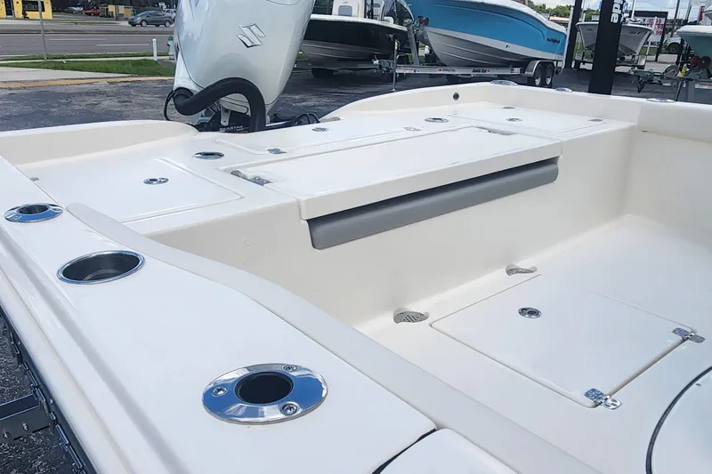 Slide: The Image of 2026 Avenger AV26 boat interior with storage compartments and cup holders. - 6