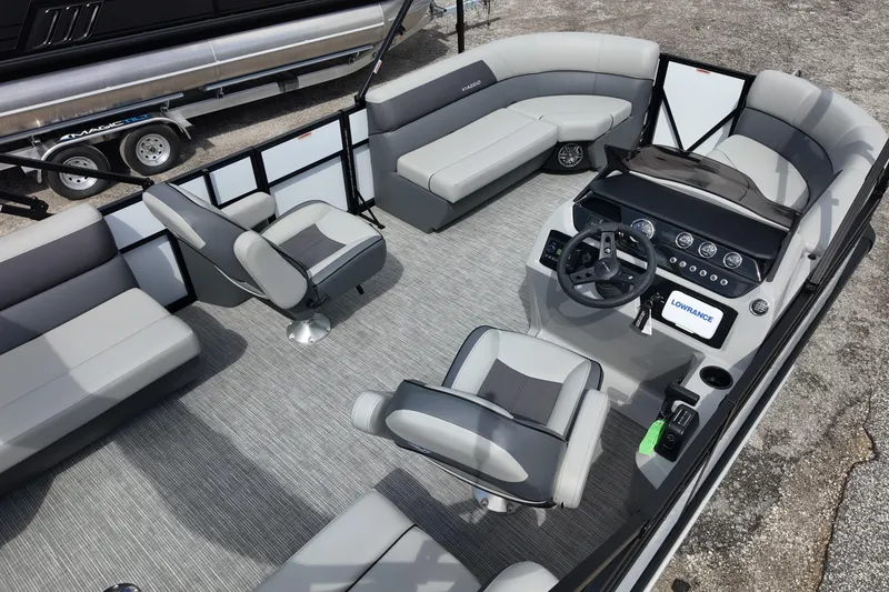 Slide: The Image of 2026 Viaggio Lago V 20 U pontoon boat interior with modern seating and steering console. - 11