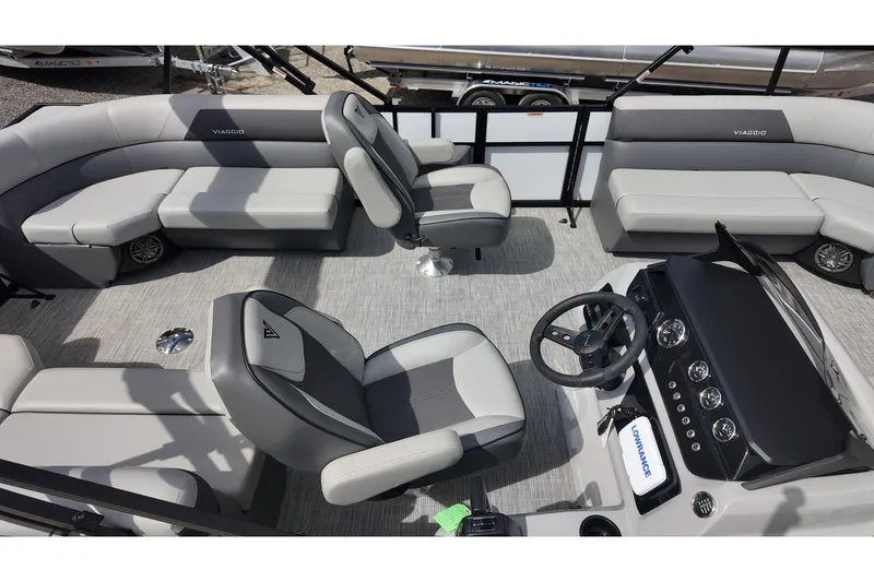 Slide: The Image of Interior of 2026 Viaggio Lago V 20 U pontoon boat with modern seating and steering console. - 12