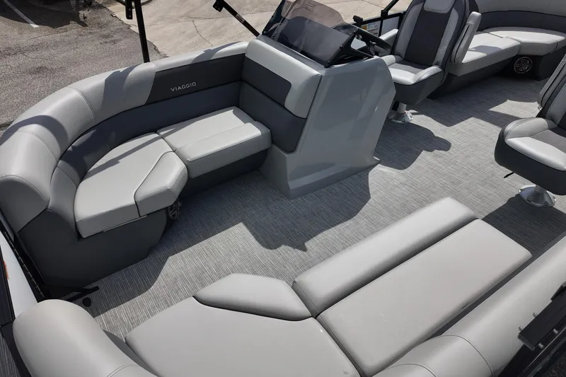 Slide: The Image of 2026 Viaggio Lago V 20 U pontoon boat interior with gray seating and helm. - 18
