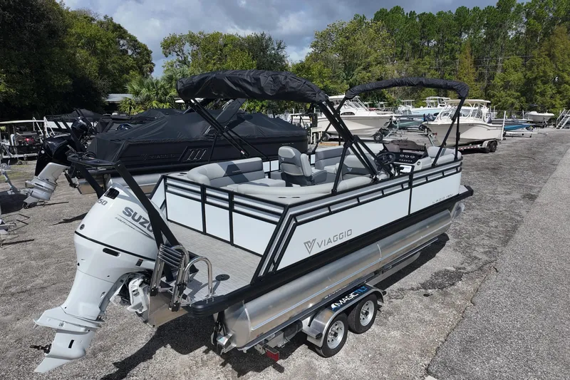 Slide: The Image of 2026 Viaggio Lago V 20 U pontoon boat with Suzuki engine on trailer. - 2