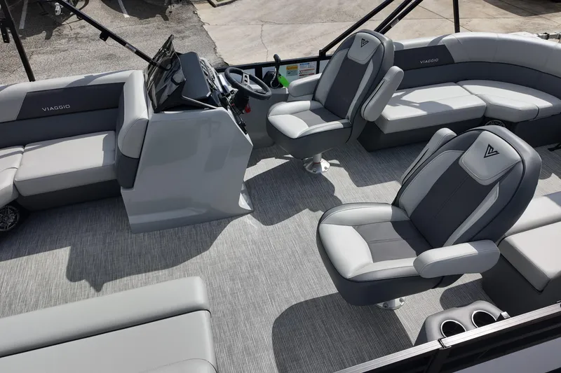 Slide: The Image of 2026 Viaggio Lago V 20 U boat interior with modern seating and steering console. - 20