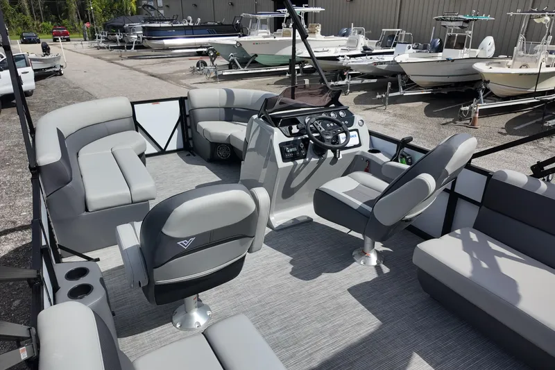 Slide: The Image of 2026 Viaggio Lago V 20 U pontoon boat interior with modern seating and steering console. - 21