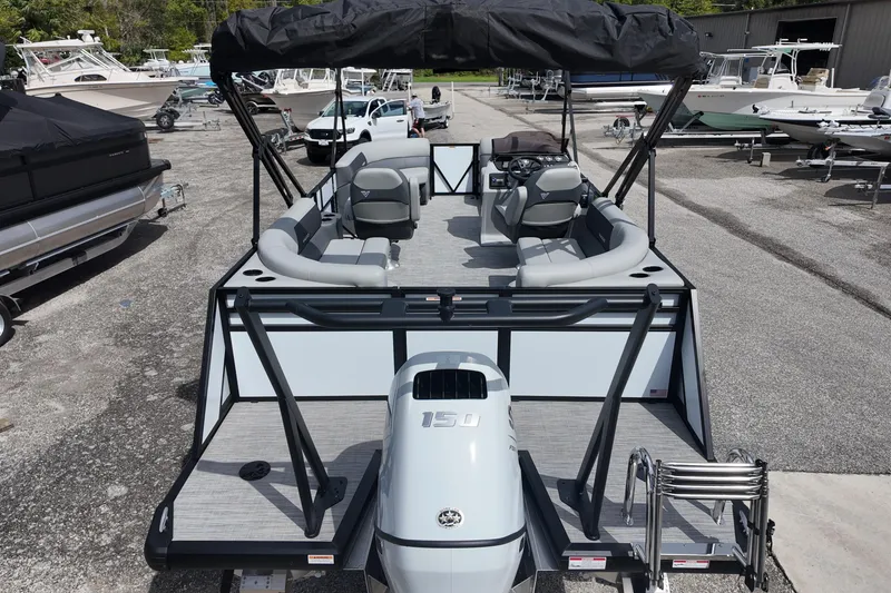 Slide: The Image of 2026 Viaggio Lago V 20 U pontoon boat with seating and outboard motor in a marina. - 9