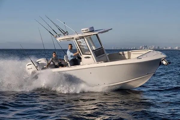 Slide: The Image of 2026 Sailfish 252 CC boat cruising on open water with fishing rods. - 7