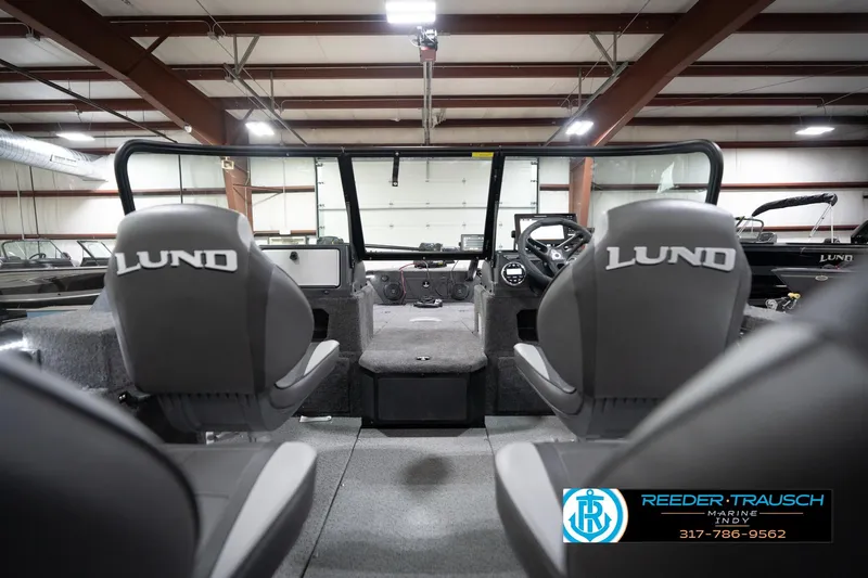 Slide: The Image of Interior view of 2026 Lund 1775 Impact XS boat with dual seats and steering console. - 16
