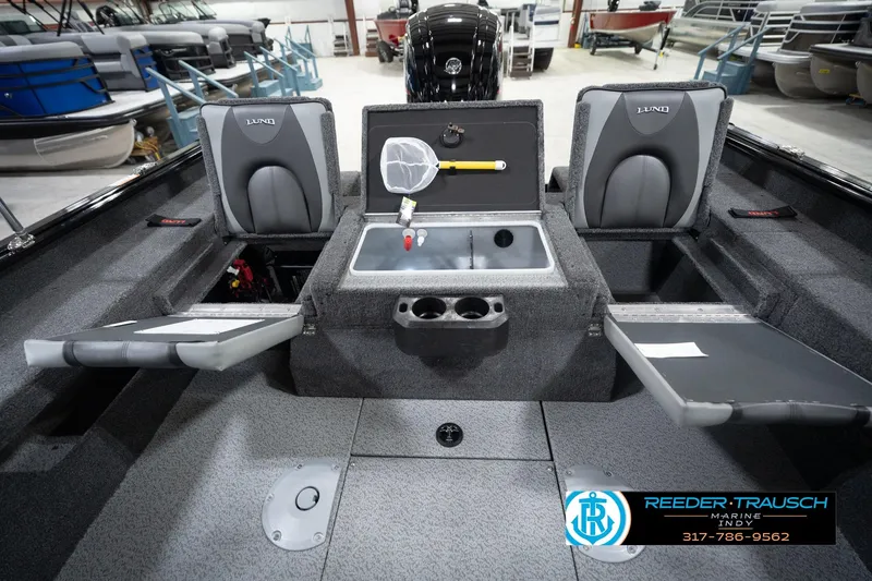 Slide: The Image of 2026 Lund 1775 Impact XS boat interior with storage compartments and seating. - 24