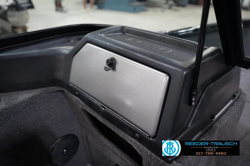 Slide: The Image of 2026 Lund 1775 Impact XS boat dashboard with storage compartment and speaker. - 25