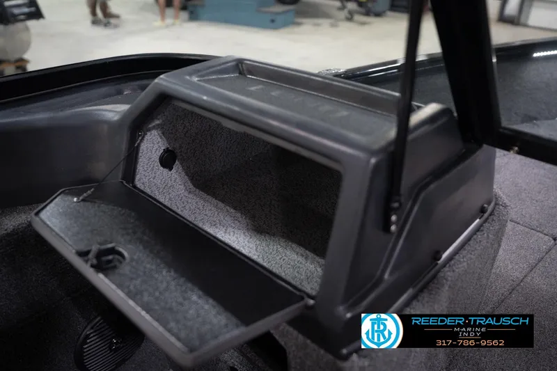 Slide: The Image of Interior storage compartment of 2026 Lund 1775 Impact XS boat, open lid, carpeted finish. - 26