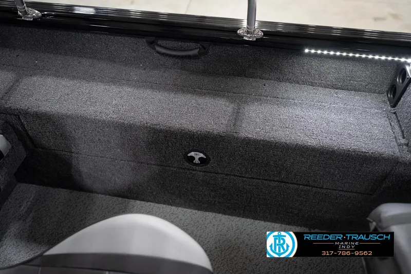 Slide: The Image of Interior of 2026 Lund 1775 Impact XS boat with carpeted flooring and seating. - 29