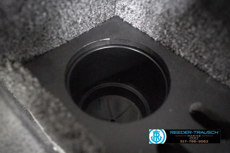 Slide: The Image of Cup holder in 2026 Lund 1775 Impact XS boat interior, Reeder-Trausch Marine logo visible. - 46