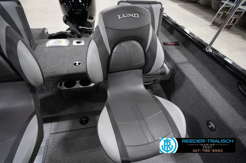 Slide: The Image of 2026 Lund 1775 Impact XS boat interior with gray seating and cup holders. - 49