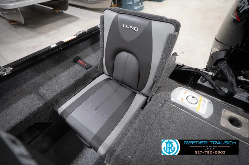 Slide: The Image of 2026 Lund 1775 Impact XS boat seat with gray upholstery and branding. - 50