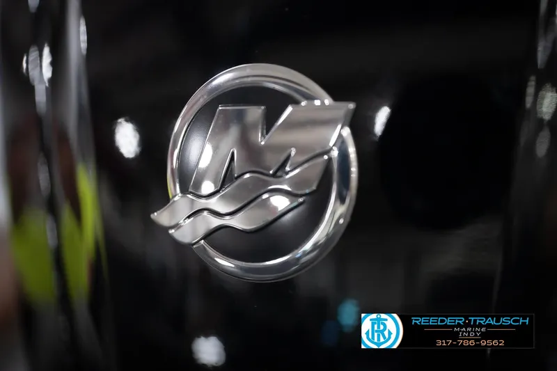 Slide: The Image of Close-up of a metallic logo on a 2026 Lund 1775 Impact XS boat. - 55