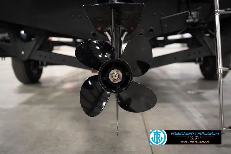 Slide: The Image of Close-up of a 2026 Lund 1775 Impact XS boat propeller in a showroom. - 56