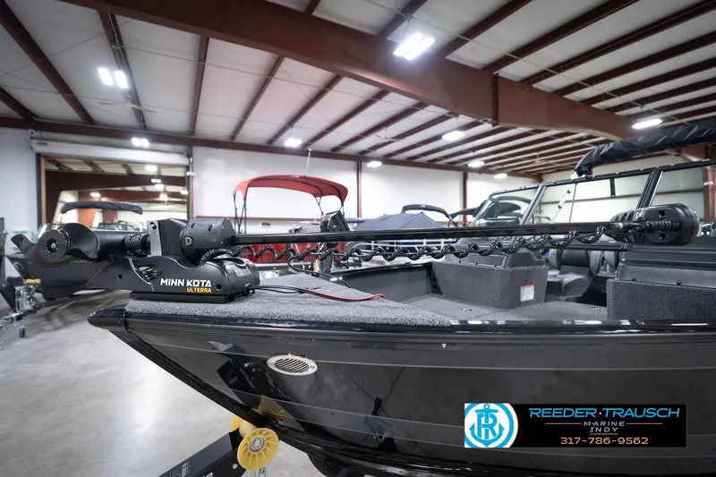 Slide: The Image of 2026 Lund 1775 Impact XS boat with Minn Kota Ulterra motor in showroom. - 57