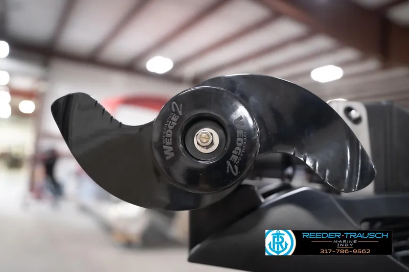 Slide: The Image of Close-up of a 2026 Lund 1775 Impact XS boat propeller in a workshop setting. - 60