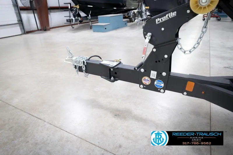 Slide: The Image of Trailer hitch of 2026 Lund 1775 Impact XS in a showroom setting. - 63