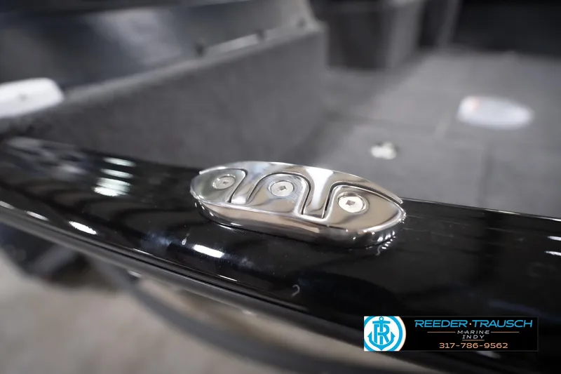 Slide: The Image of Close-up of a 2026 Lund 1775 Impact XS boat cleat, featuring sleek design and shiny finish. - 68