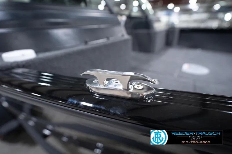 Slide: The Image of 2026 Lund 1775 Impact XS boat cleat detail, sleek design, Reeder-Trausch Marine logo visible. - 69