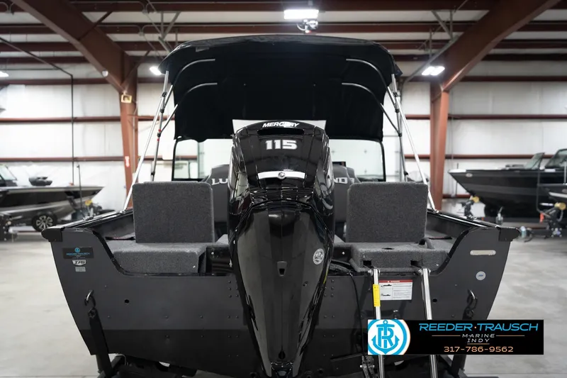 Slide: The Image of 2026 Lund 1775 Impact XS boat with Mercury 115 engine in showroom. - 9