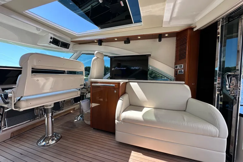 Slide: The Image of Luxurious interior of 2009 Sea Ray 60 Sundancer yacht with plush seating and modern amenities. - 12