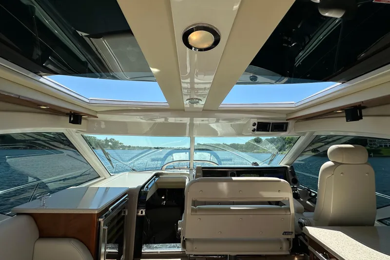 Slide: The Image of Interior view of 2009 Sea Ray 60 Sundancer yacht with panoramic windows. - 13