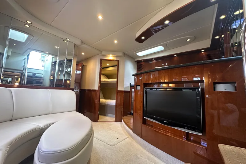 Slide: The Image of Luxurious interior of 2009 Sea Ray 60 Sundancer yacht with plush seating and entertainment system. - 19