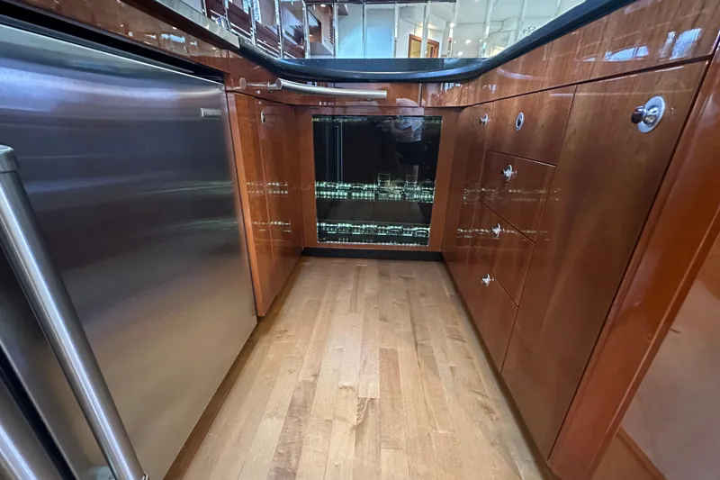 Slide: The Image of Luxurious 2009 Sea Ray 60 Sundancer yacht kitchen with wood cabinetry and stainless steel appliances. - 22