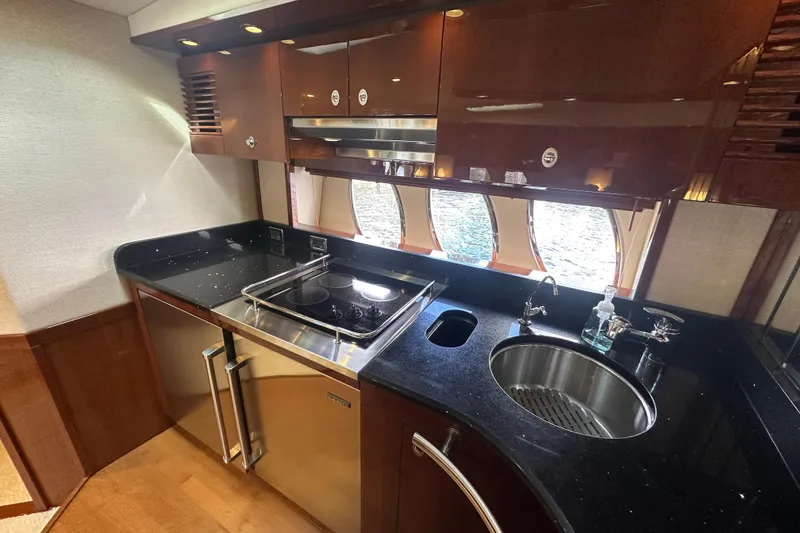 Slide: The Image of Luxurious kitchen interior of 2009 Sea Ray 60 Sundancer yacht with modern appliances. - 23