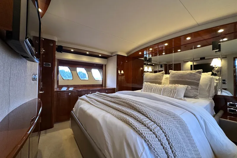 Slide: The Image of Luxurious bedroom interior of 2009 Sea Ray 60 Sundancer yacht with elegant decor. - 26